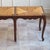 A two-seater bench of french manufacture in the louis xv style, crafted around 1960 based on 18th-century models. The low,...