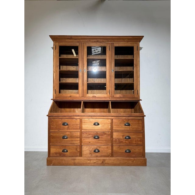 This impressive teak display cabinet combines timeless craftsmanship with practical storage. Handcrafted from solid teak...