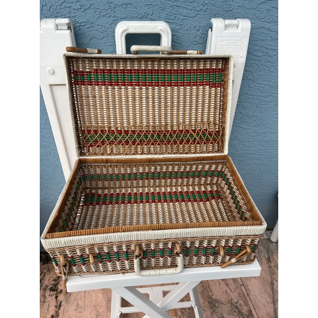 Vintage wicker and vinyl picnic basket. Red, green and white, peg locking and wicker pouch for plates or papers. It...