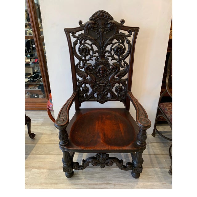 Exceptionally well carved mahogany chair with floral design, cherub and gargoyles beautifully carved and great patination...
