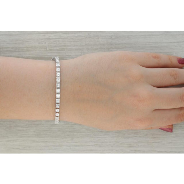 Gemstone Information: - Natural Diamonds - Total Carats - 10ctw (3.5 mm each) Cut - Step Cut Squares Color - E - G Clarity...