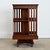A very practical and fun design, this square revolving bookcase would have been made in England circa 1870 using mahogany...