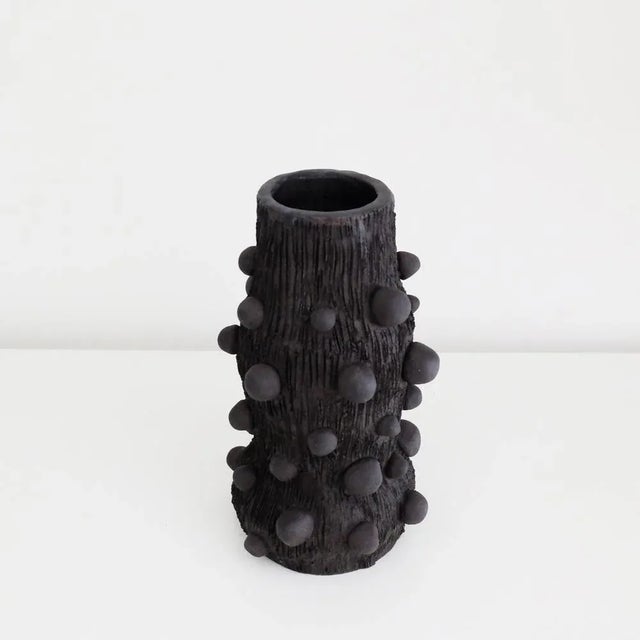 Atom vase by ia kutateladze one of a kind dimensions: w 10 x h 21 cm. Materials: black clay. Handbuilt from black clay....