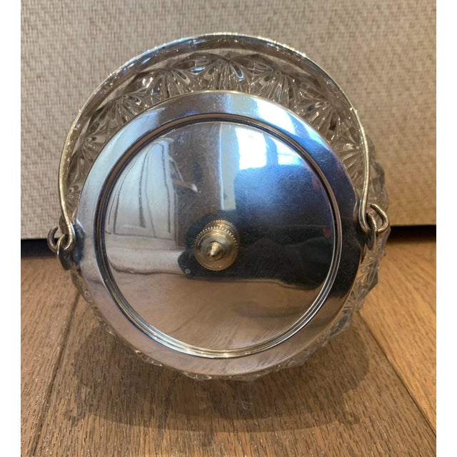 Vintage Crystal and silver biscuit jar with traditional etched crystal pattern and polished silver plate handle and lid.