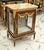 This elegant Louis XV-style marquetry bedside cabinet showcases refined French craftsmanship with a sophisticated blend of...