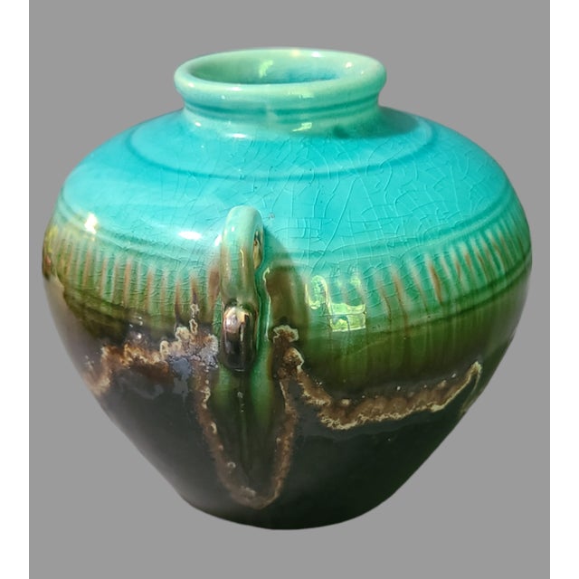 This vintage art pottery vase is a unique addition to any collection. The vase stands at 5.25 inches tall and 6.75 inches...