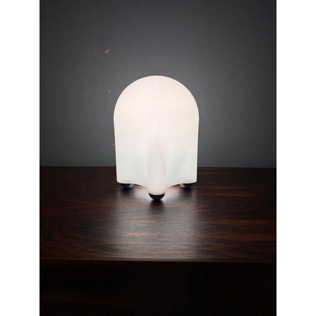 Iconic Drop table lamp designed by Giotto Stoppino in 1976 and produced by Tronconi, Italy. The lamp features a...