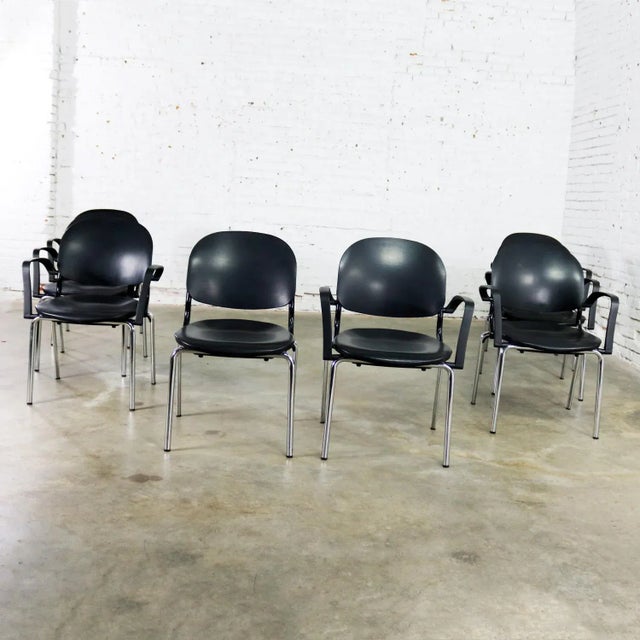 Excellent set of 8 black Torsion dining chairs designed by Giancarlo Piretti for KI. There are seven arm chairs and one...
