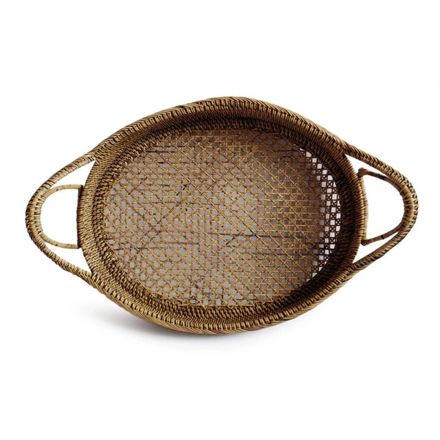Vintage hand woven tea stain rattan oval tray with handles. Each slightly unique in natural material differences and...
