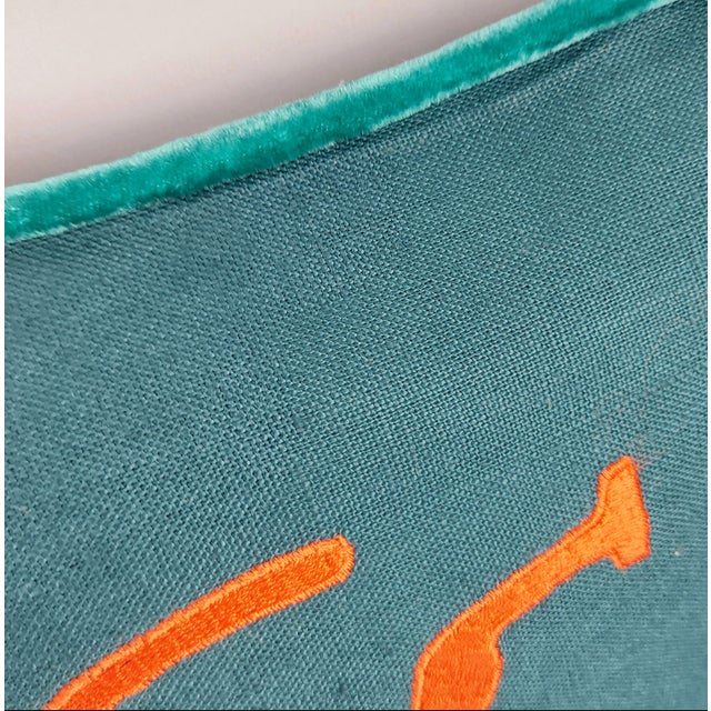 Bold and graphic, this decorative pillow features a stylized beetle motif brought to life through silk velvet appliqué and...