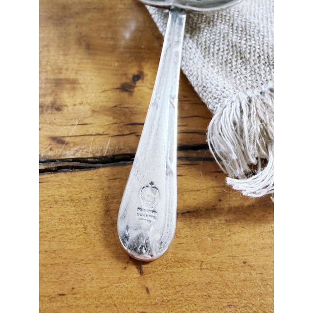 An antique circa 1920s silver plated loose tea infuser/strainer from the Hong Kong & Shanghai Hotels company! The company...