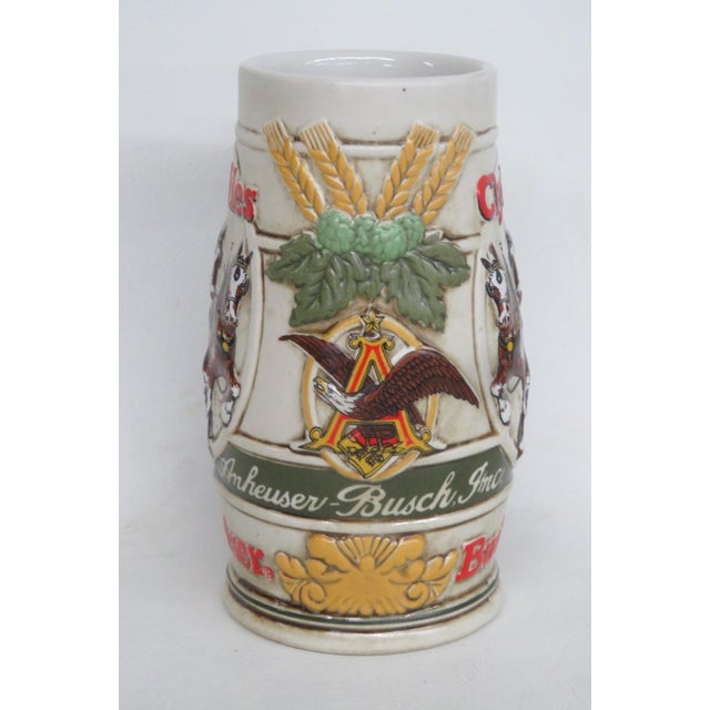 This charming Budweiser Beer Stein is made of ceramic. This collectible Budweiser beer stein is stamped as being handmade...