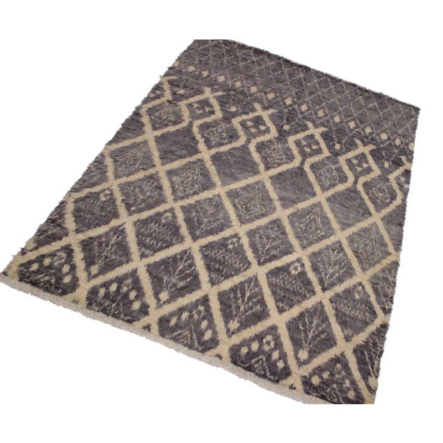 Hand knotted from finest quality wool, this one-of-a-kind fashionable handmade Moroccan rug crafted by skilled artisans...