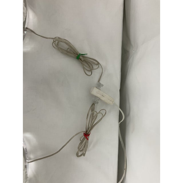 A striking and whimsical pair of sculptural table lamps featuring elegant swan forms, beautifully rendered in a crisp...