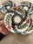 A beautifully cohesive set of five hand-painted studio pottery salad plates signed P. Silkotch and dated 1993. Created by...