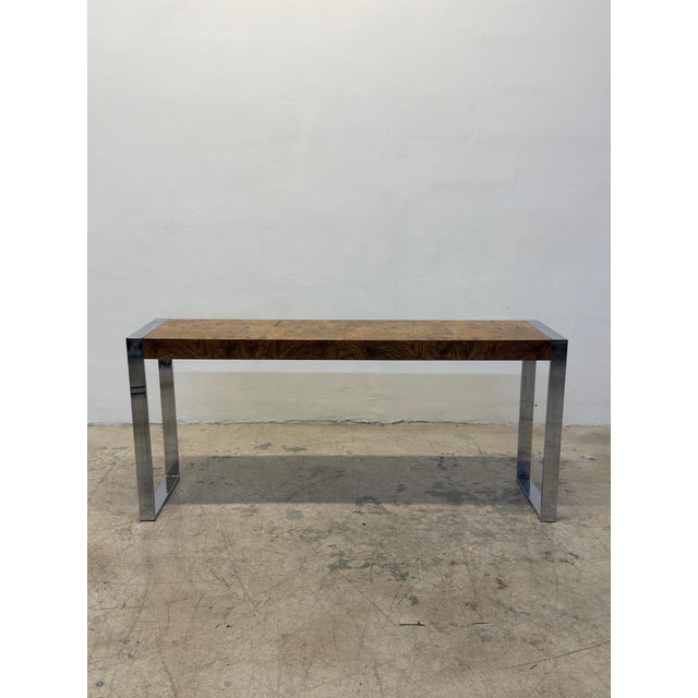 Mid-Century Drexel console table with burlwood veneer top on a polished chrome base with brass accents.