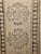A vintage Turkish Oushak runner from the second quarter of the 20th century, featuring a refined multiple medallion design...