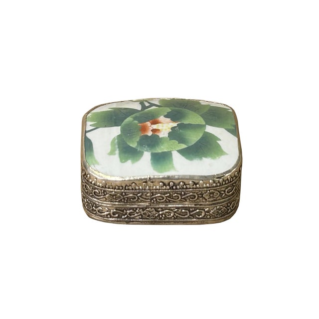 This is a handmade pewter box in an irregular shape with an old white base color oriental flower graphic porcelain part...