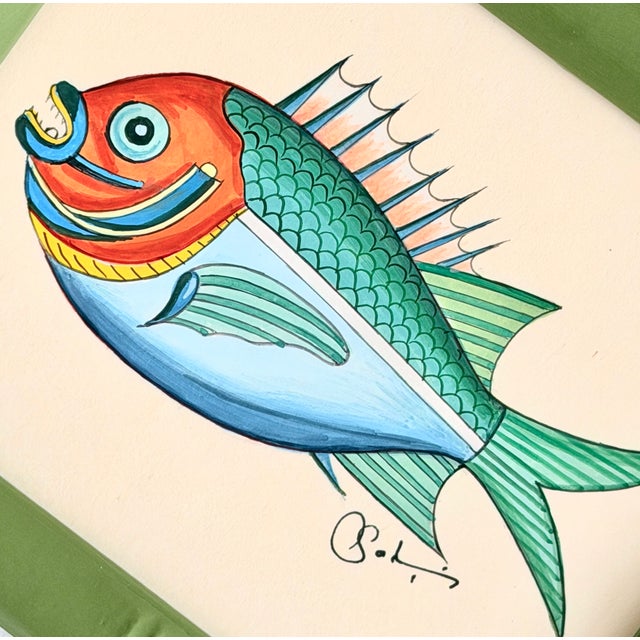 A bright and cheerful fish painting, hand-painted by master artists using acrylic paints and natural pigments. He is full...