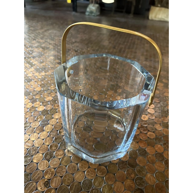 Beautiful Crystal Cartier ice bucket with brass handle. In excellent vintage condition. Makers mark engraved on bottom.
