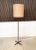 This minimalist high-quality floor lamp was manufactured in Germany during the early 1960s. It features a pole made from...