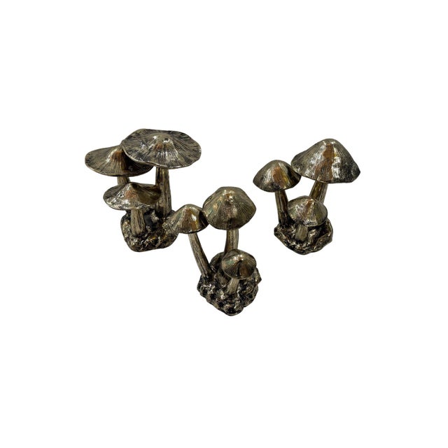 A charming set of cast bronze mushroom sculptures, each composition capturing the quiet beauty and organic irregularity of...