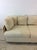 This mid century modern three seater sofa features wicker arms and sides with original finish and overstuffed removable...
