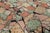 This remarkable vintage rug, crafted in Europe during the 1950s, is a vivid testament to mid-century modernist...