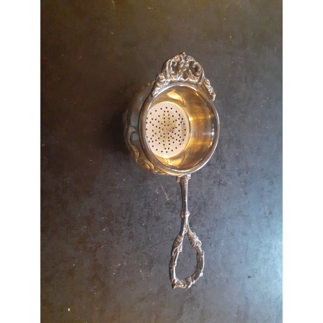 This is a GORGEOUS Silverplate Tea Bag or Lemon Strainer Basket Spoon & Cup. Procured at auction Other similar strainers...