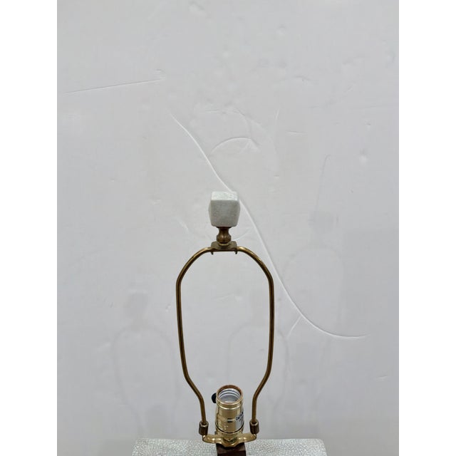 Currey & Co Tristan Lamp. Porcelain body, crackle glaze, brass accents. Showroom floor sample.