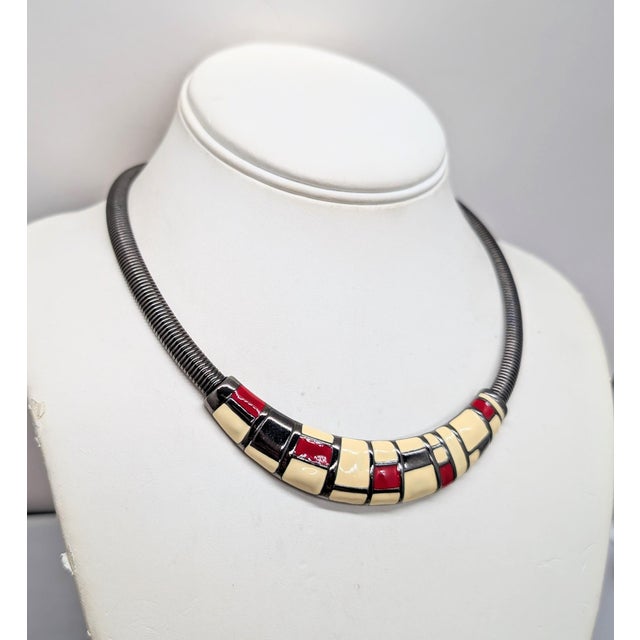 1980s gunmetal with Mondrian inspired white, red and dark grey metalic enamel pattern on the front of the collar necklace...
