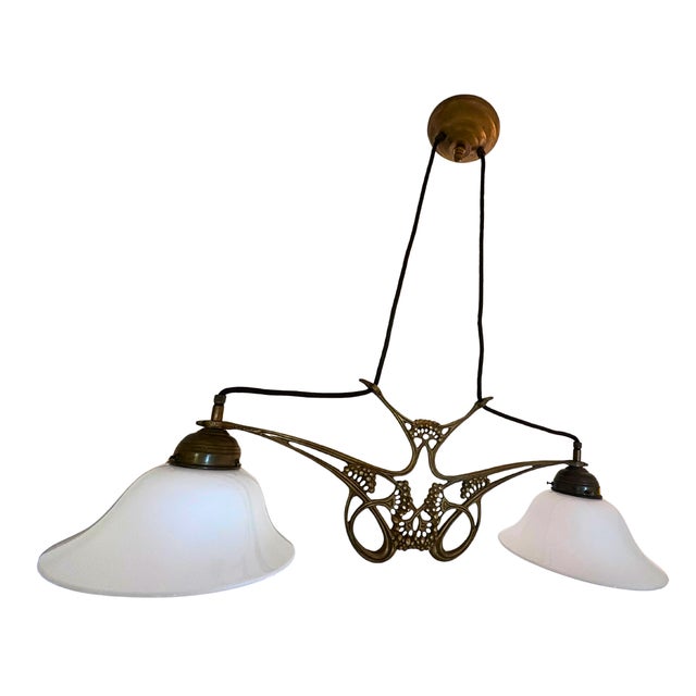 A wonderfully poetic French Art Nouveau chandelier with flowing organic lines and an almost botanical silhouette. Far from...