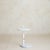 A French postmodern side table from the 1980s, composed of white metal with a solid marble base. Defined by clean geometry...