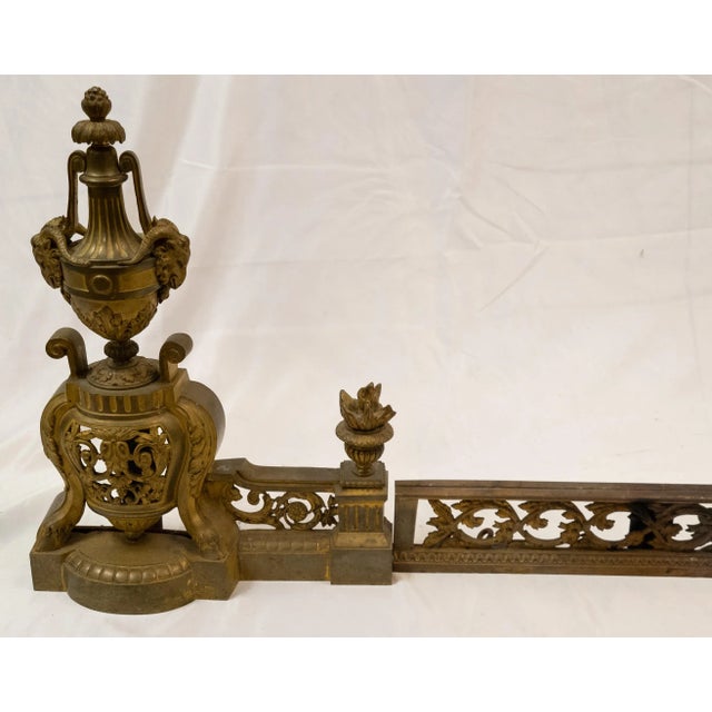 We are selling this nice French Bronze ormolu gilt fire set. This small scale set of Chenets and fender are very high...
