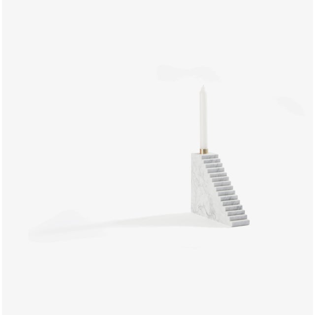 This candleholder is made of Carrara marble.