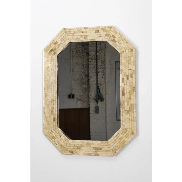 Beautiful mirror in a frame of mosaïc. In a good vintage condition, no obvious traces of use. Measurements H. 77 cm; B....