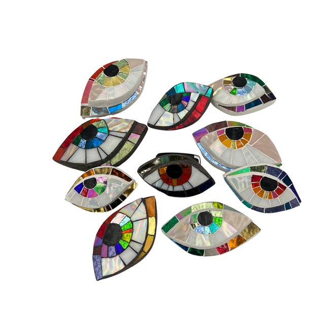 Glass and mirror mosaic eye wall sculpture by Mallorca-based, German-born mosaics-focused artist, Ruth Minola Scheibler....