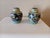 Cute Asian cloisonne twin small pots. Has a flower, bird, and geometric motif. Normal wear for age. Some chips of enamel....