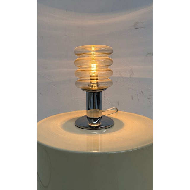 Elegant small German table lamp in the style of Peill & Putzler Up to 250V (Europe/UK Standard).The wiring of this item...