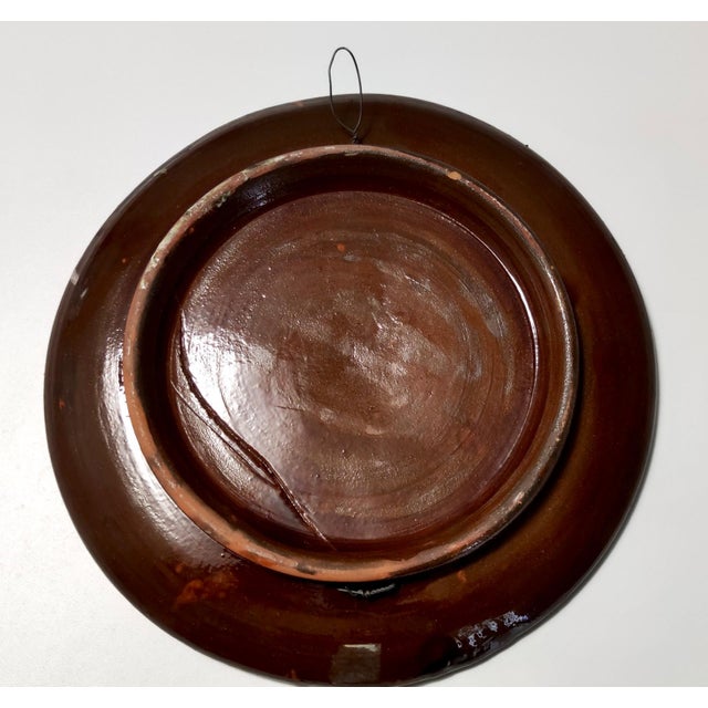 Made in Italy, 1950s. This is a glazed ceramic plate depicting two clown with two contrasting behaviors, which gives the...