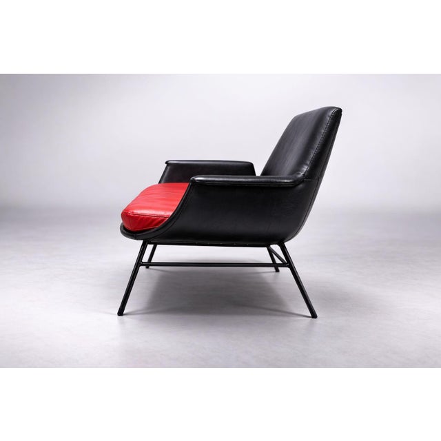 This two-seat sofa was produced in Czechoslovakia in the 1960s, reflecting the principles of Mid-Century Modern and...