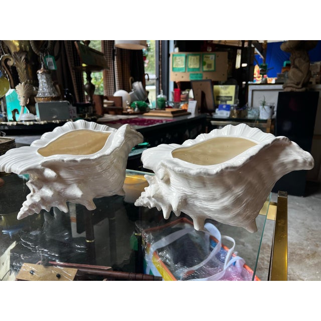 Up for consideration is a beautiful vintage pair of large white ceramic shell style planters. These would look lovely in...