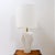 Large white ceramic table lamp, in Art Deco style, with a sculptural fan-shaped base. Lamp sold without lampshade....