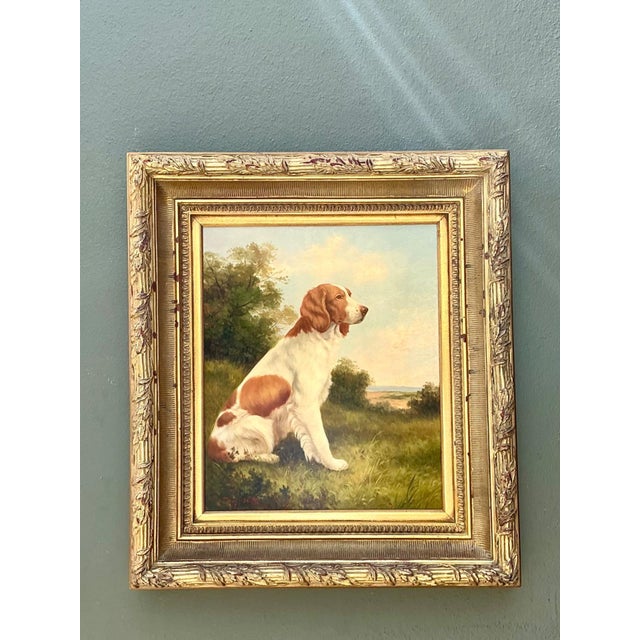 This exquisite early 20th-century oil on canvas by artist Jem Nutt captures a poised Spaniel within a serene pastoral...