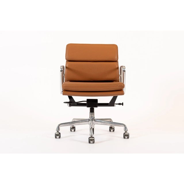 This authentic Eames for Herman Miller Soft Pad Management Height brown leather office chair from the Aluminum Group...