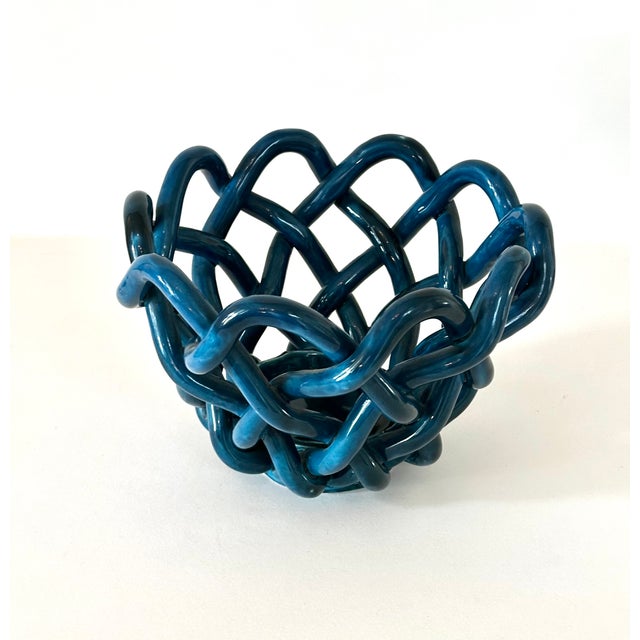 Large woven ceramic center piece bowl in glossy cerulean blue glaze. Handcrafted and possibly of French or Italian origin....