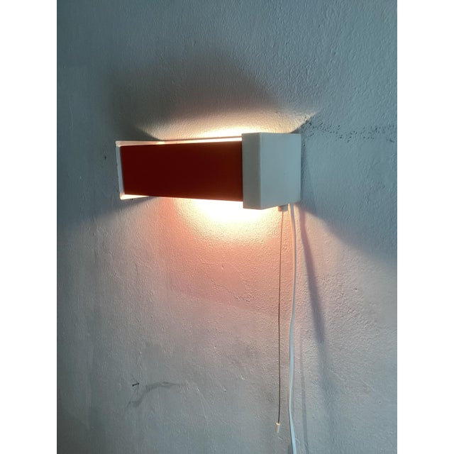 Wall Lamp by Niek Hiemstra Orange for Hiemstra Evolux, 1970, in Very Good conditions. Designed 1970 to 1979 I have...