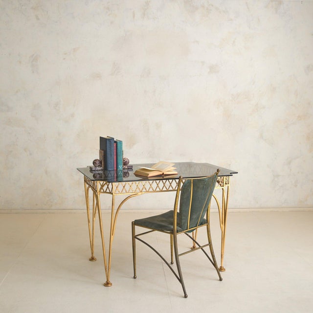An Italian gilt bronze desk or petite dining table, crafted circa 1950s1960s and sourced from the Banci family estate in...