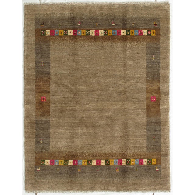 Hand-knotted Persian Lori Gabbeh rug featuring a soft brown field enclosed by a subtle tonal border with minimal tribal...