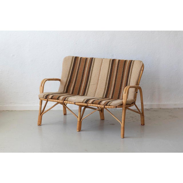 Danish Rattan Lounge Set with Sofa, Armchairs and Coffee Table, 1970s, Set of 4, in Good conditions. Designed 1970 to 1979